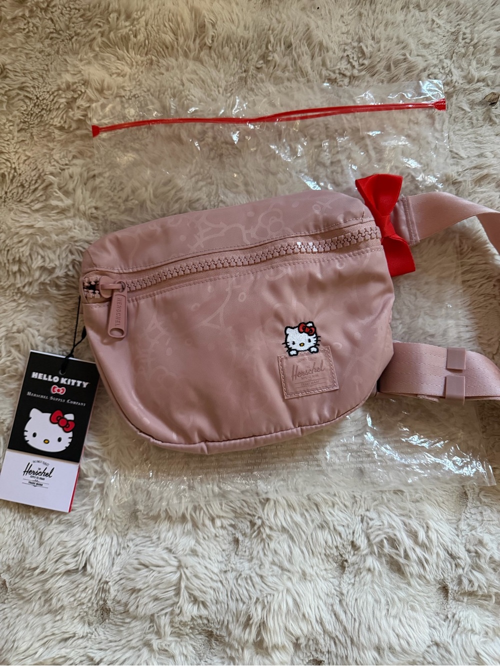 Herschel Supply Company Pink Hello Kitty Kids Waist Bag with Red Bow Accent
